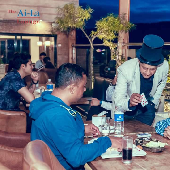 Close-up card magic at a restaurant